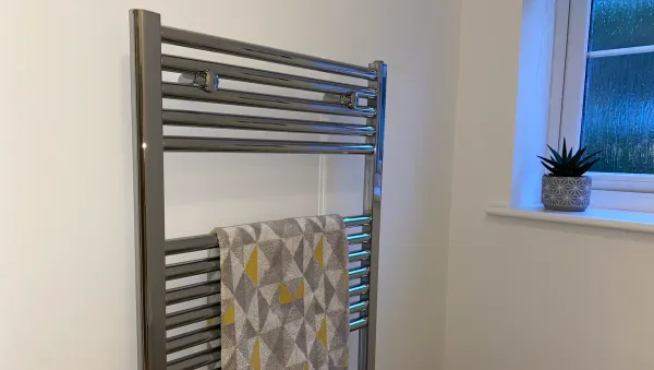Fit a heated towel rail radiator Fit a heated towel rail radiator