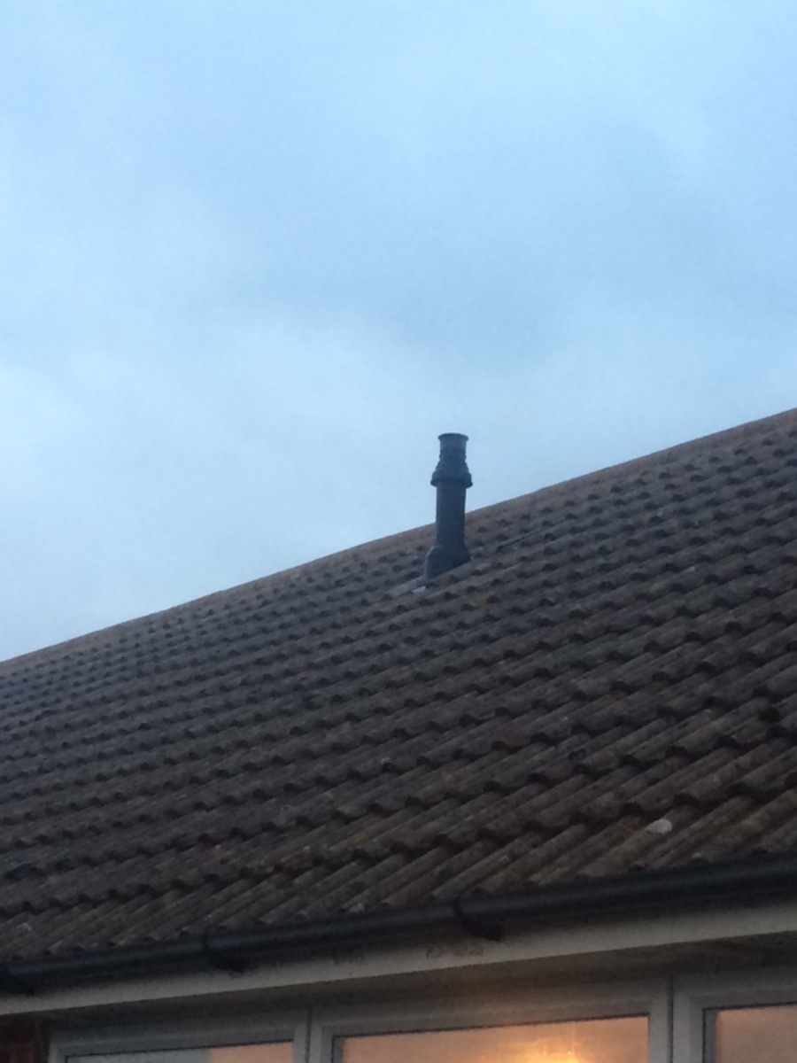 Flue terminal through pitched roof for above boiler 