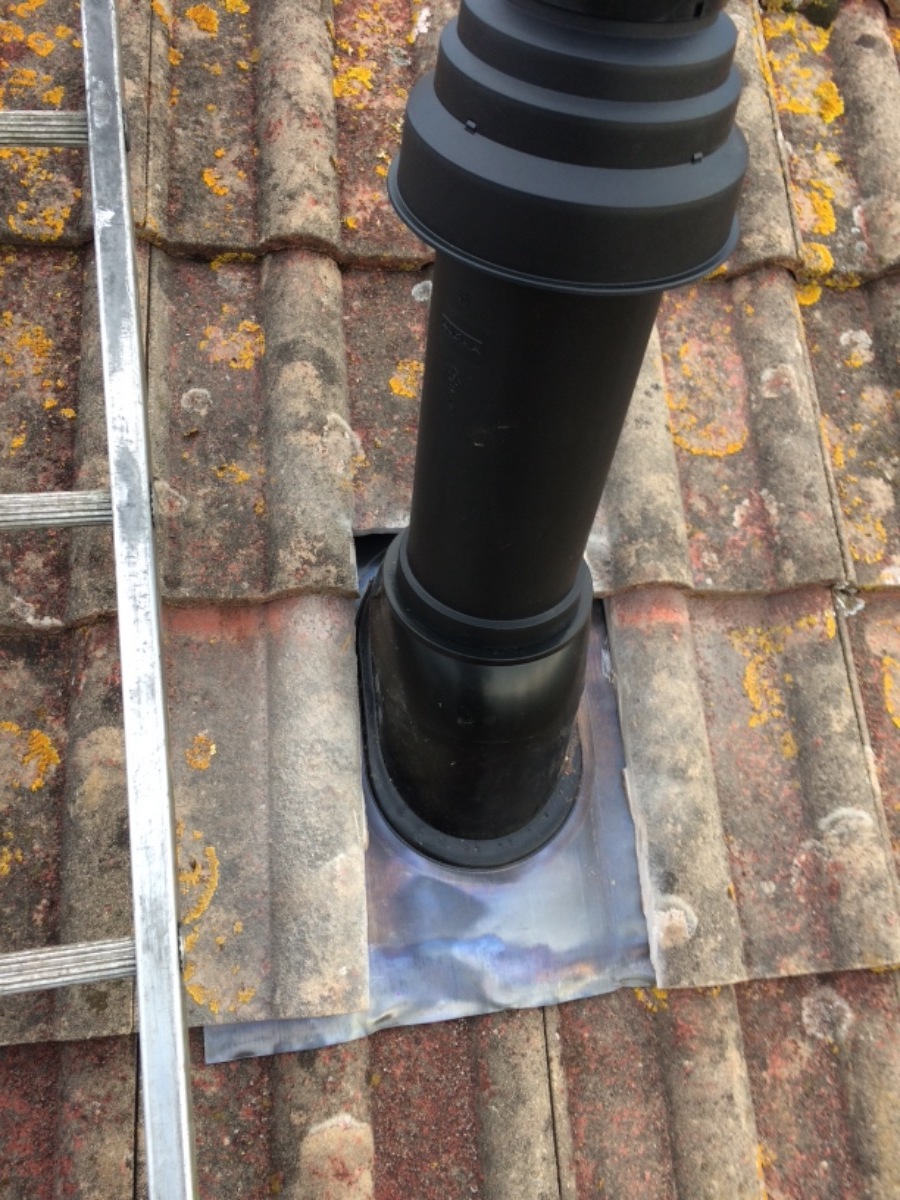 Flue terminal going through pitched roof 